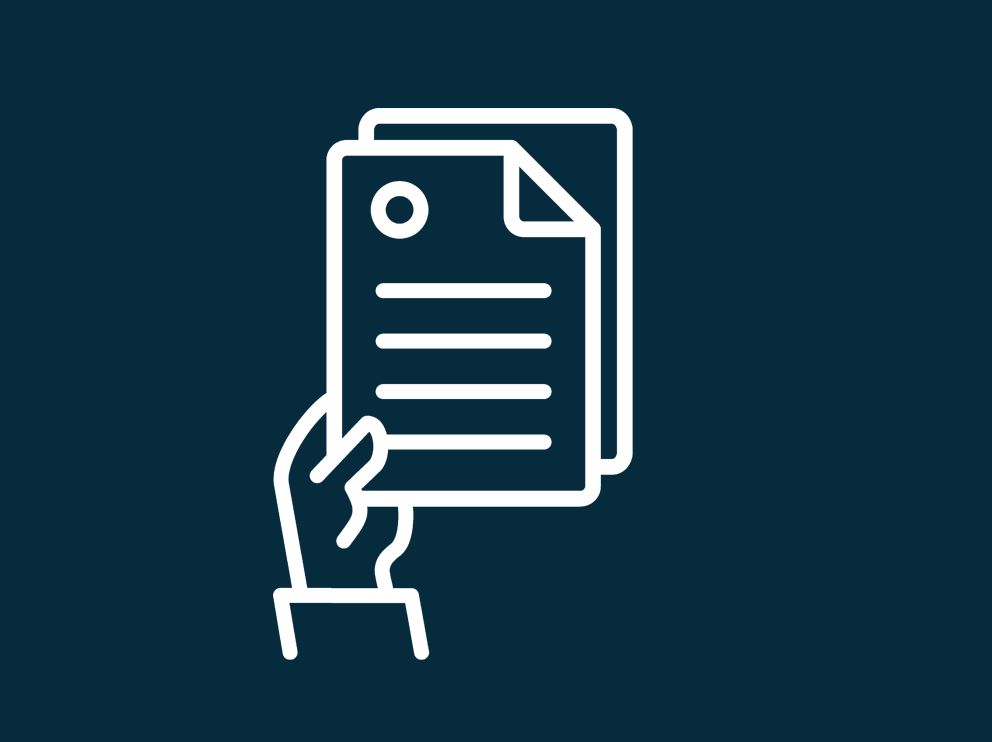 a hand holding papers
