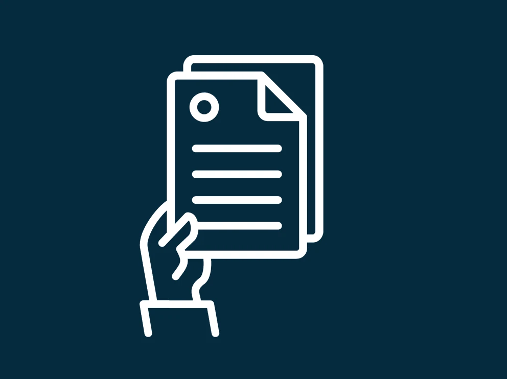 a hand holding papers