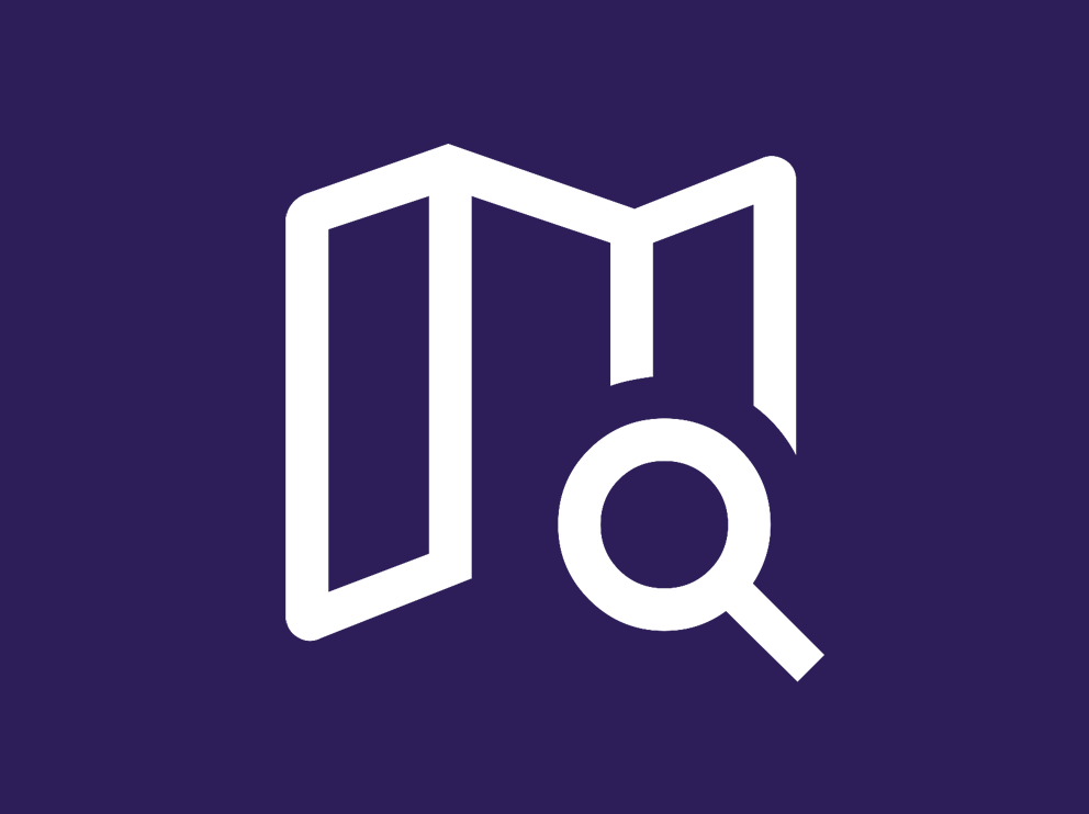 An icon of a magnifying glass looking at a map