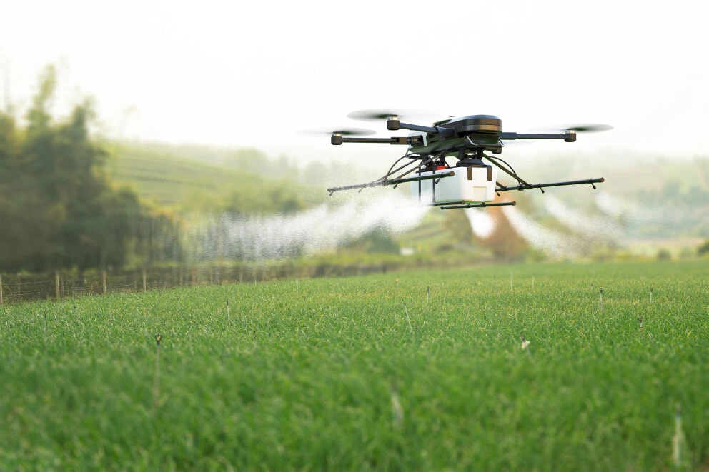 an agricultural drone above a crop field