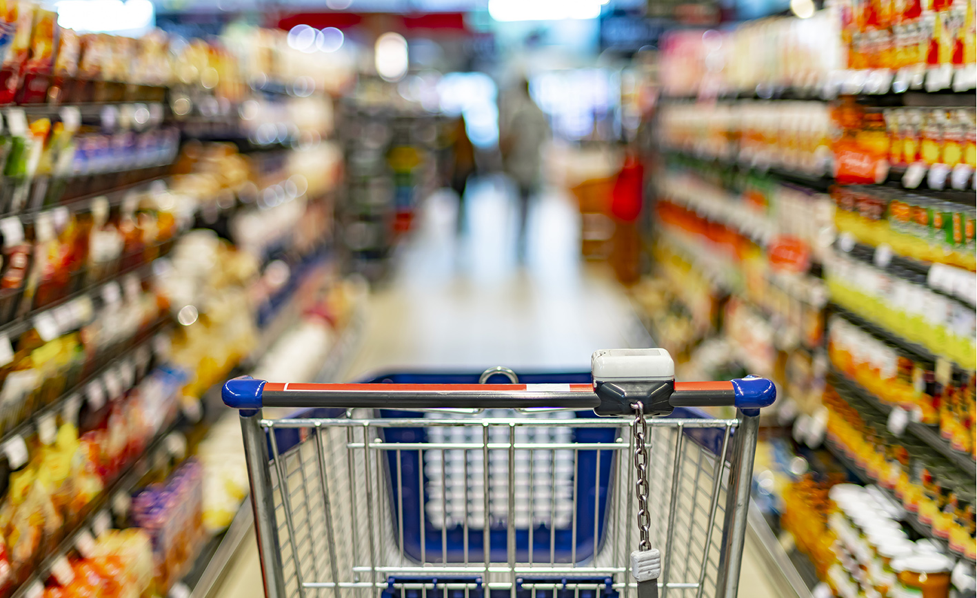 A shopping trolley in a supermarket aisle