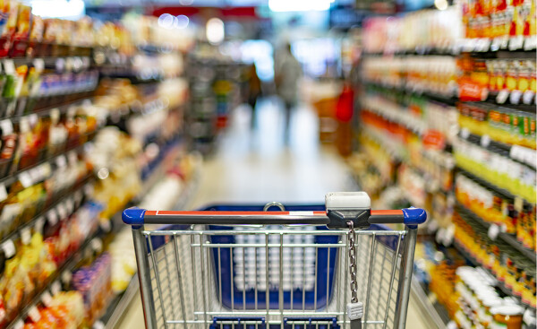 A shopping trolley in a supermarket aisle