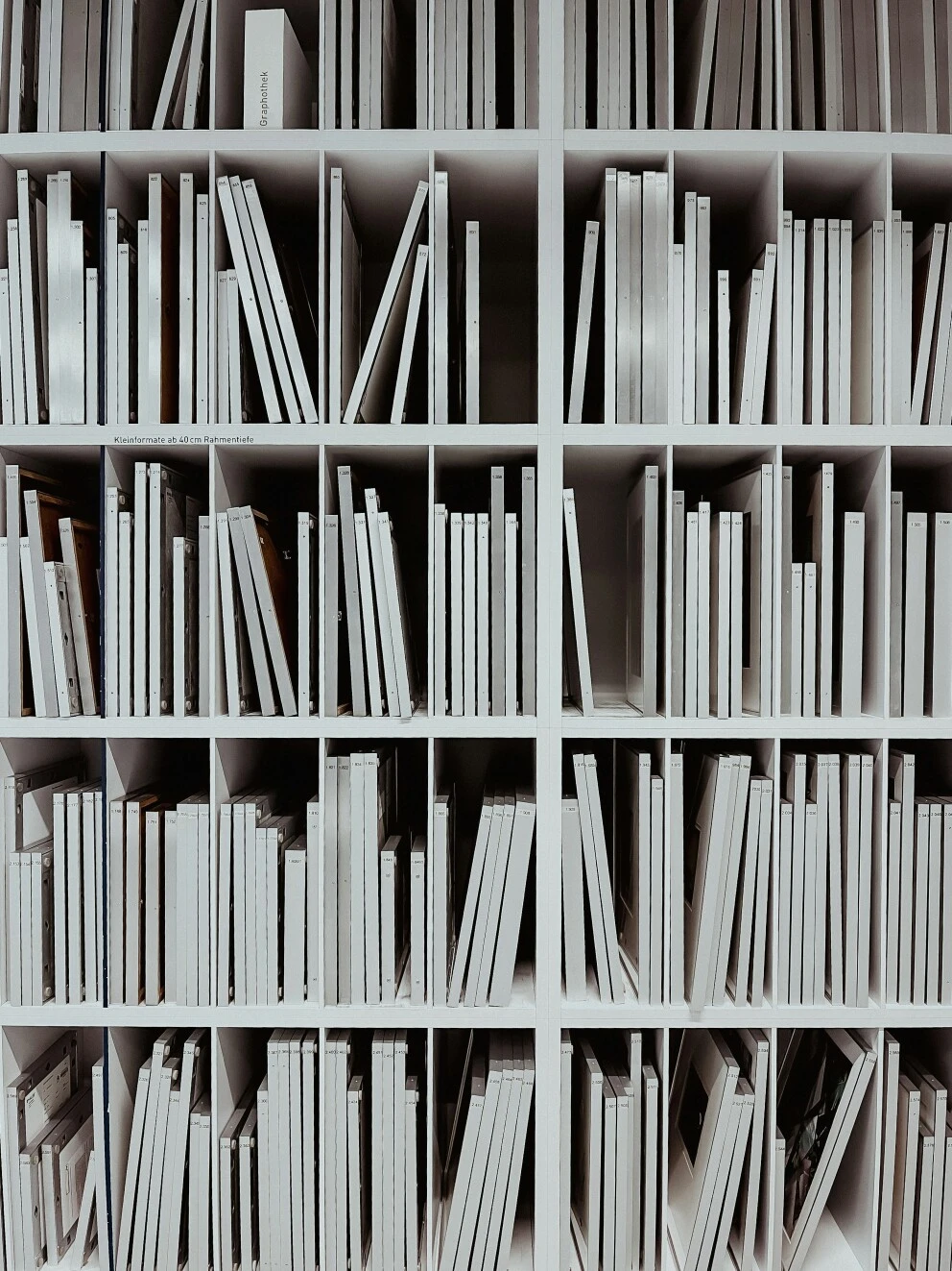 A bookshelf full of non-descript books