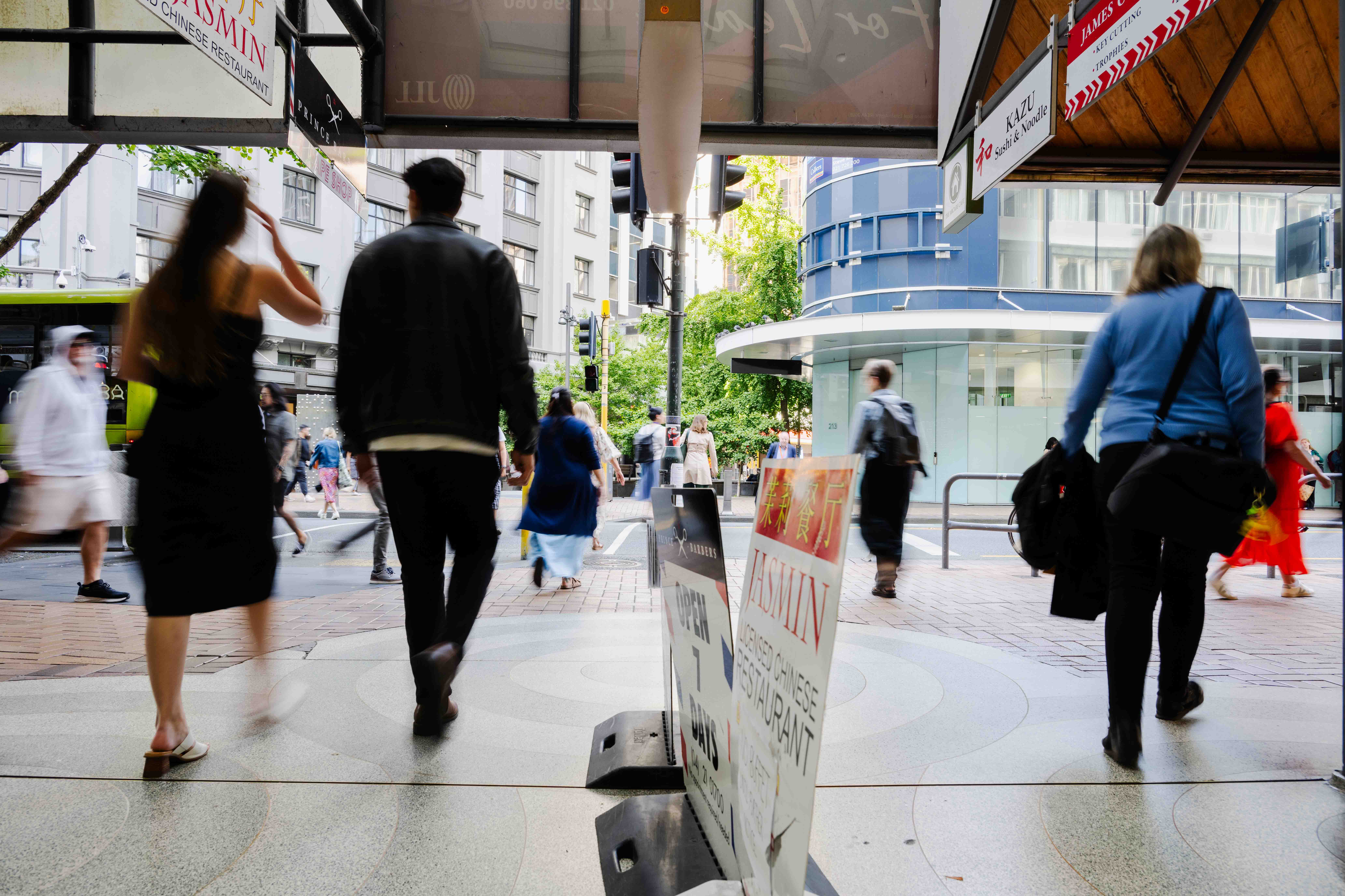 People walking along a busy city street